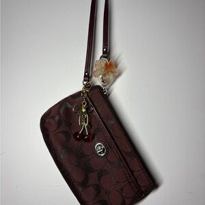 Burgundy coach wristlet